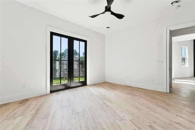 5651 W End Blvd, New Orleans, LA 70124 - empty room with healthy amount of natural light, french doors, light wood-style floors, and ceiling fan