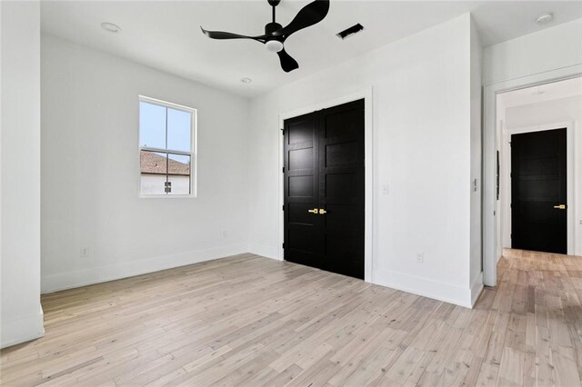5651 W End Blvd, New Orleans, LA 70124 - unfurnished bedroom with light wood-style floors and a ceiling fan