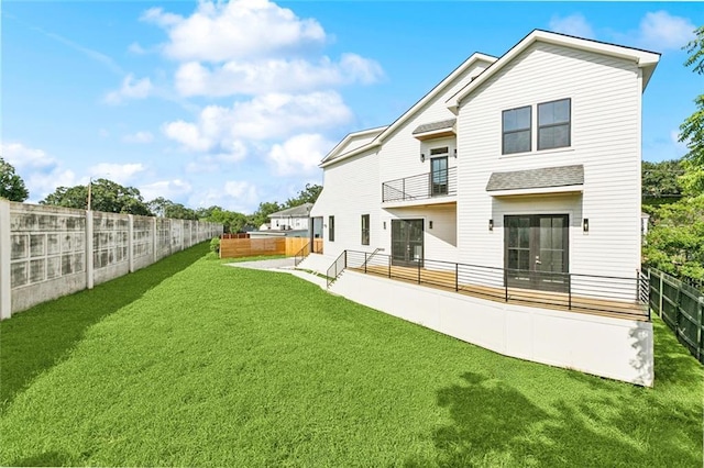 5651 W End Blvd, New Orleans, LA 70124 - back of house featuring a balcony and a fenced backyard