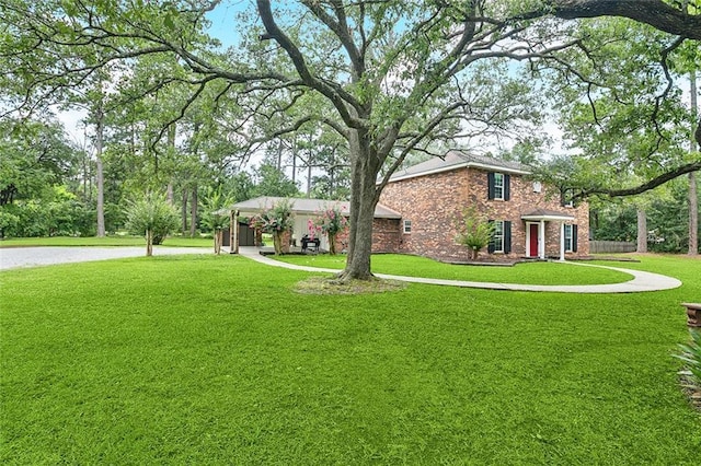 314 Royal Dr, Slidell, LA 70460 - view of front of house featuring a front yard and brick siding