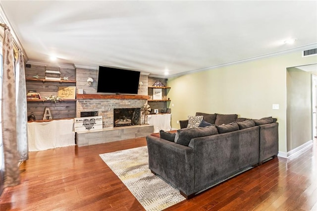 314 Royal Dr, Slidell, LA 70460 - living room featuring a fireplace, ornamental molding, wood finished floors, and recessed lighting