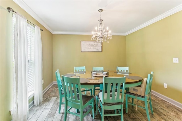 314 Royal Dr, Slidell, LA 70460 - dining area with a chandelier, wood finished floors, and crown molding
