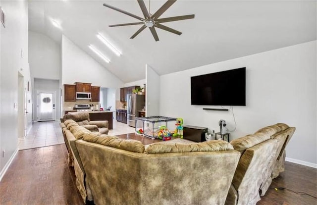 10596 Braves Ave, Denham Springs, LA 70726 - living area featuring a ceiling fan, high vaulted ceiling, and dark wood-type flooring