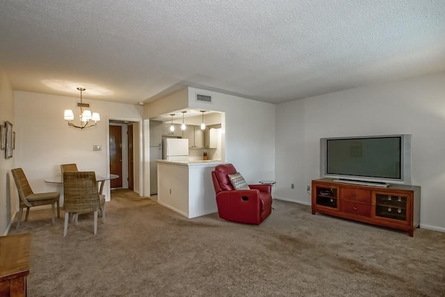 2708 Whitney Pl Unit 901, Metairie, LA 70002 - carpeted living area with a chandelier and a textured ceiling