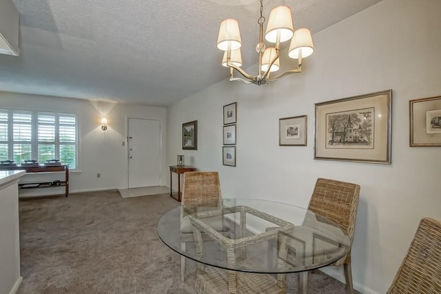 2708 Whitney Pl Unit 901, Metairie, LA 70002 - dining room featuring a chandelier, carpet flooring, and a textured ceiling
