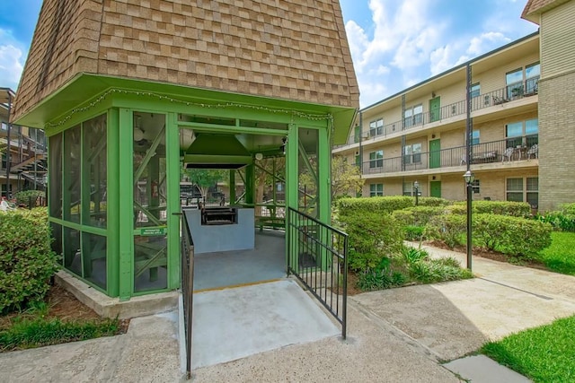 2708 Whitney Pl Unit 901, Metairie, LA 70002 - doorway to property with a shingled roof and mansard roof