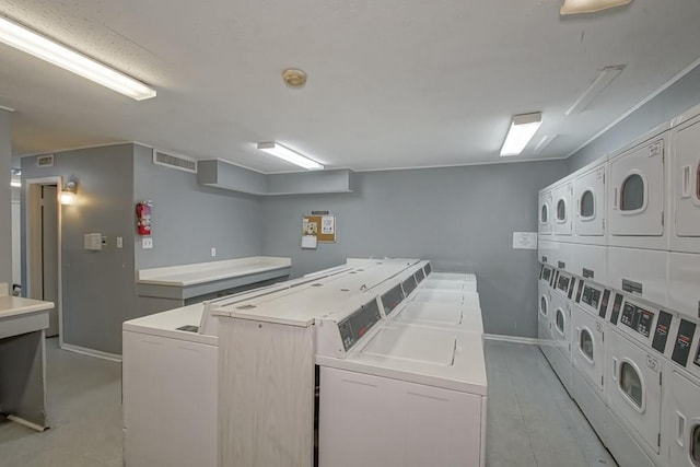 2708 Whitney Pl Unit 901, Metairie, LA 70002 - shared laundry with stacked washer and clothes dryer and washer and dryer