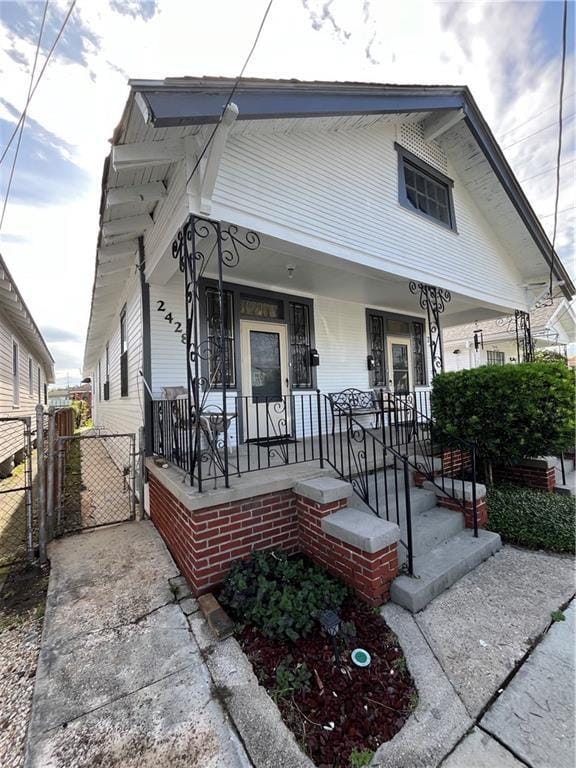242830 A P Tureaud Ave, New Orleans, LA 70119 - shotgun-style home featuring a gate and a porch