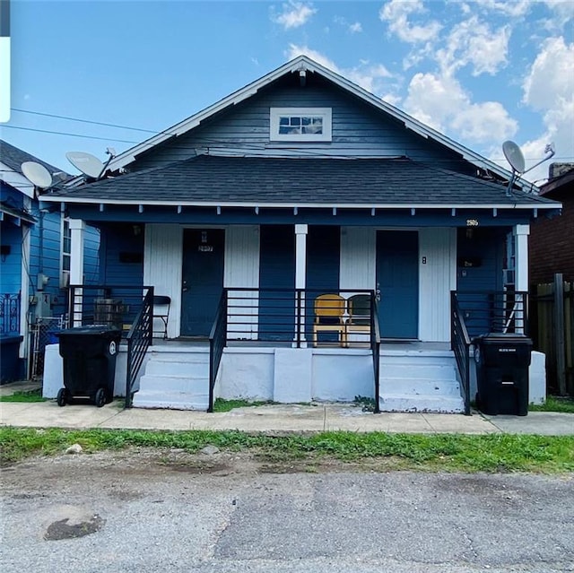 2905-07 Pauger St, New Orleans, LA 70119 - view of front facade with roof with shingles and covered porch