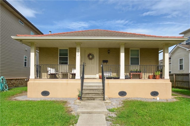 685759 Vicksburg St, New Orleans, LA 70124 - bungalow-style house featuring a porch, brick siding, and a front yard