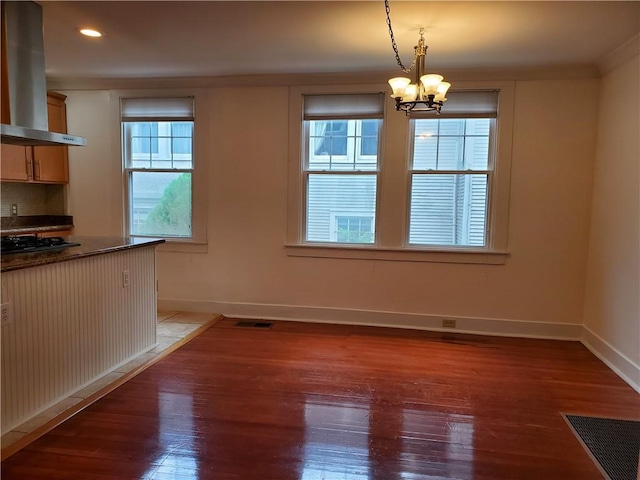 411 Lowerline St Unit D, New Orleans, LA 70118 - unfurnished dining area with light wood finished floors, a chandelier, and recessed lighting