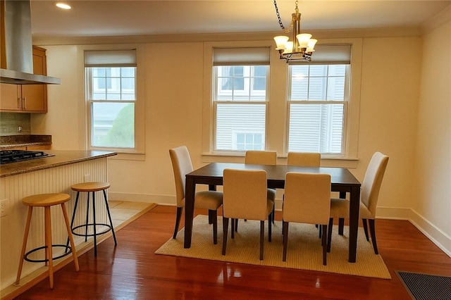 411 Lowerline St Unit D, New Orleans, LA 70118 - dining area with healthy amount of natural light, wood finished floors, a chandelier, and recessed lighting