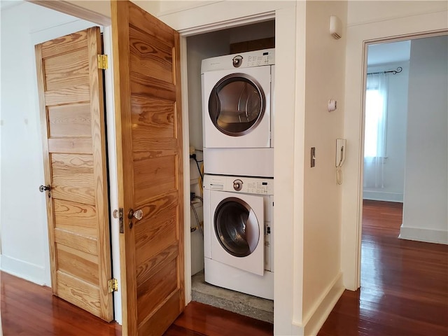 411 Lowerline St Unit D, New Orleans, LA 70118 - laundry room featuring stacked washer / drying machine and dark wood finished floors