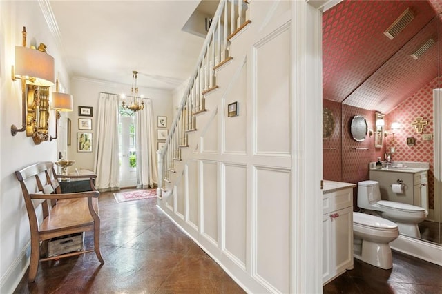 502 Hector Ave, Metairie, LA 70005 - foyer with stairway, ornamental molding, a chandelier, and vaulted ceiling