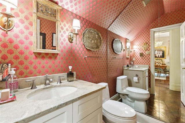502 Hector Ave, Metairie, LA 70005 - bathroom featuring wallpapered walls, vaulted ceiling, vanity, and tile patterned floors