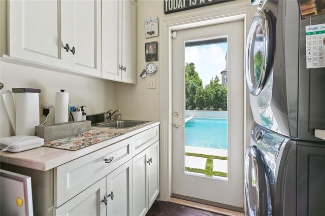 502 Hector Ave, Metairie, LA 70005 - washroom featuring estacked washer and dryer and cabinet space