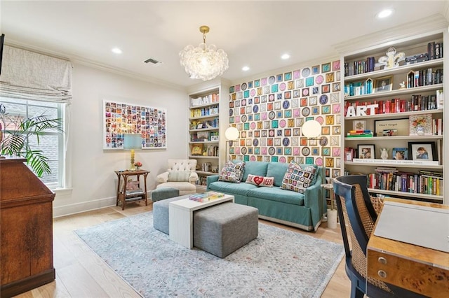 502 Hector Ave, Metairie, LA 70005 - sitting room with ornamental molding, a chandelier, recessed lighting, and light wood-type flooring