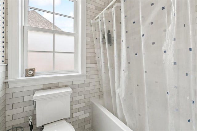 502 Hector Ave, Metairie, LA 70005 - bathroom with tile walls and shower / bath combination with curtain