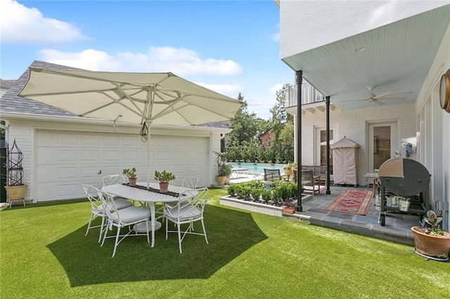 502 Hector Ave, Metairie, LA 70005 - view of green lawn with ceiling fan, a patio area, an outdoor pool, and a garage