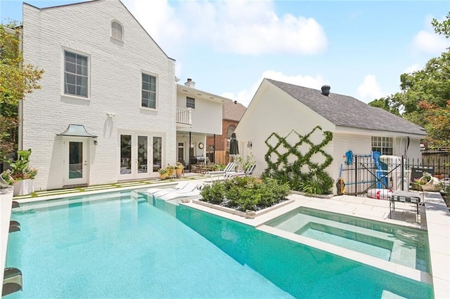502 Hector Ave, Metairie, LA 70005 - rear view of property featuring an in-ground hot tub, french doors, a patio, and brick siding