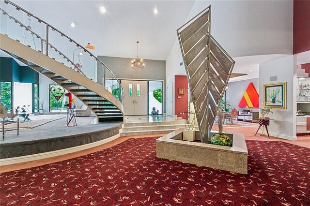 738 English Turn Ln, New Orleans, LA 70131 - entryway featuring stairway, a chandelier, recessed lighting, and a high ceiling