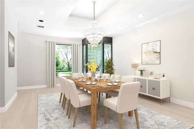 738 English Turn Ln, New Orleans, LA 70131 - dining room featuring a chandelier, light wood-type flooring, recessed lighting, and a tray ceiling