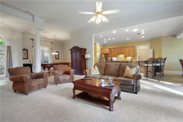 1071 Rue Chinon, Mandeville, LA 70471 - living area featuring ornamental molding, light colored carpet, ornate columns, a ceiling fan, and recessed lighting