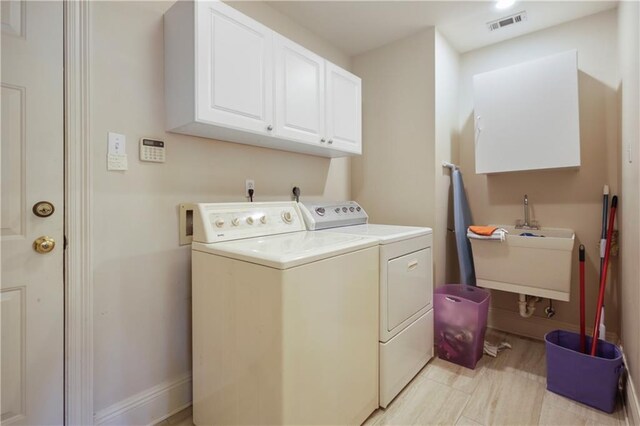 1071 Rue Chinon, Mandeville, LA 70471 - washroom featuring independent washer and dryer and cabinet space