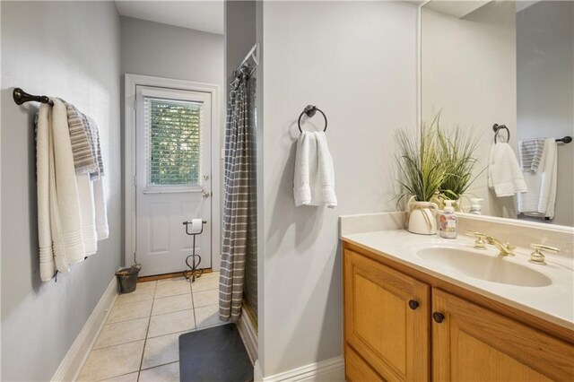 1071 Rue Chinon, Mandeville, LA 70471 - bathroom featuring vanity, tile patterned flooring, and curtained shower