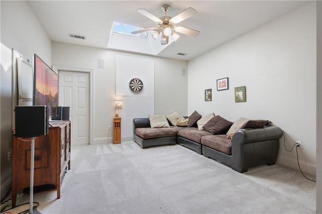 1071 Rue Chinon, Mandeville, LA 70471 - living area with a skylight, ceiling fan, and light carpet