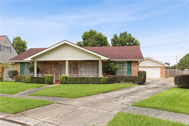 142 E Randall Ct, Gretna, LA 70053 - ranch-style home featuring brick siding, concrete driveway, covered porch, and roof with shingles