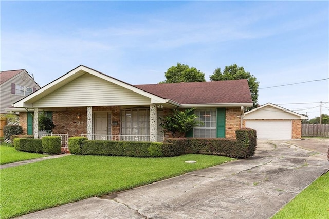 142 E Randall Ct, Gretna, LA 70053 - ranch-style home with brick siding, driveway, covered porch, and an outdoor structure