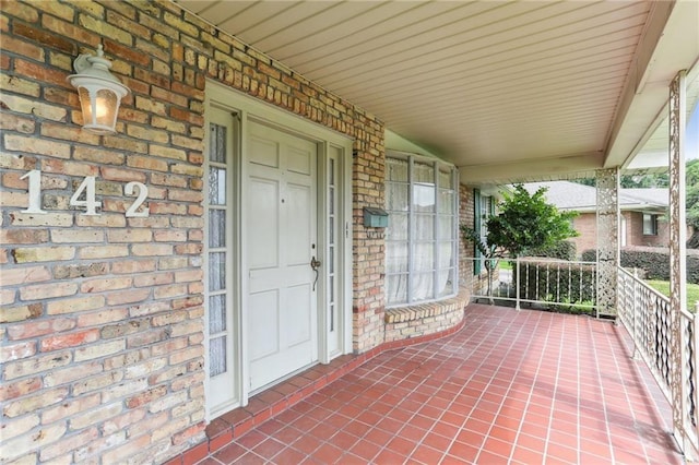 142 E Randall Ct, Gretna, LA 70053 - property entrance featuring a porch and brick siding