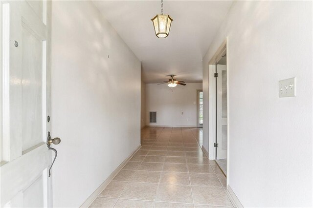 142 E Randall Ct, Gretna, LA 70053 - hall featuring baseboards and light tile patterned floors