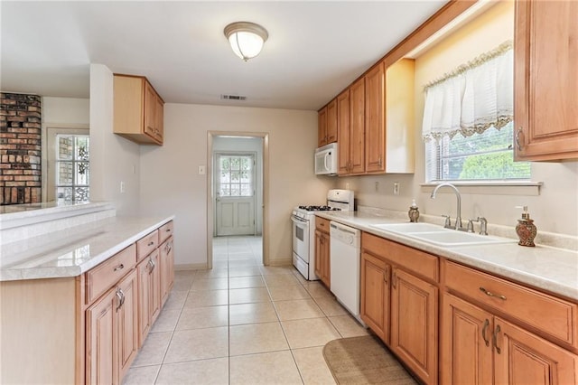 142 E Randall Ct, Gretna, LA 70053 - kitchen featuring white appliances, light countertops, and light tile patterned flooring