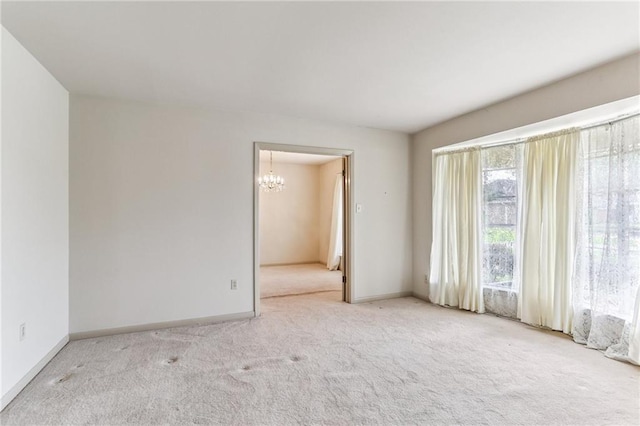 142 E Randall Ct, Gretna, LA 70053 - empty room with a chandelier and carpet floors