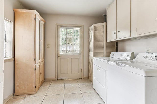 142 E Randall Ct, Gretna, LA 70053 - washroom with washing machine and clothes dryer, cabinet space, and light tile patterned floors