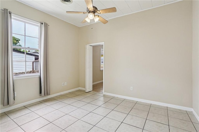 53941 Angela St, Arabi, LA 70032 - empty room featuring ceiling fan, light tile patterned flooring, and ornamental molding