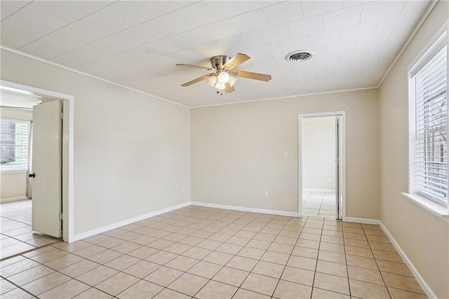53941 Angela St, Arabi, LA 70032 - unfurnished room with a ceiling fan, plenty of natural light, ornamental molding, and light tile patterned floors