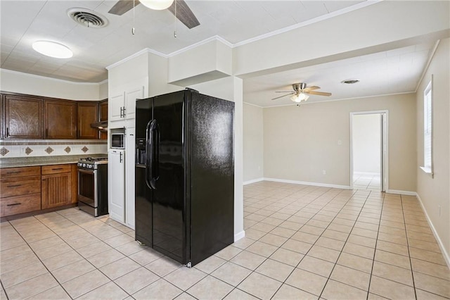 53941 Angela St, Arabi, LA 70032 - kitchen featuring appliances with stainless steel finishes, ceiling fan, light tile patterned floors, and crown molding