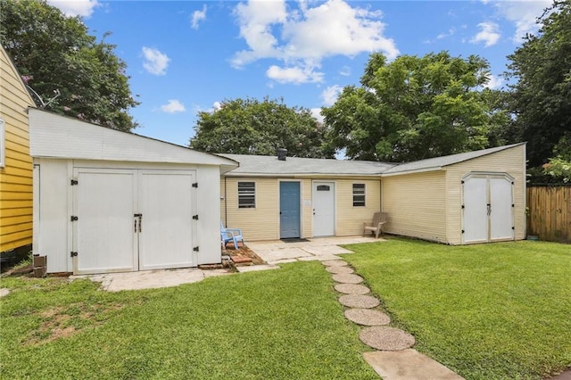 53941 Angela St, Arabi, LA 70032 - back of house with a storage unit