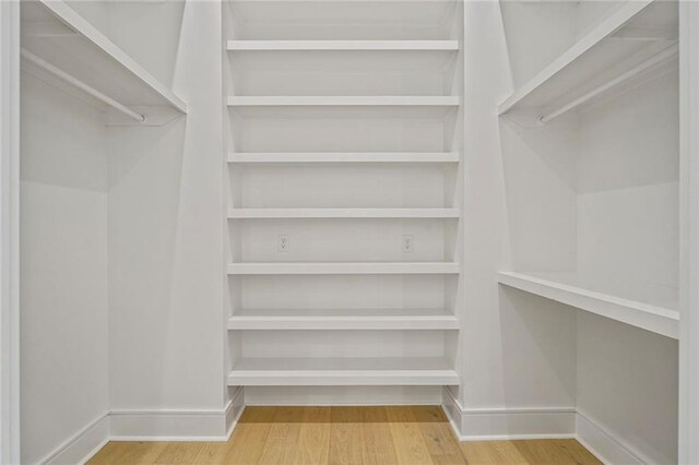 5310 Laurel St, New Orleans, LA 70115 - spacious closet featuring wood finished floors