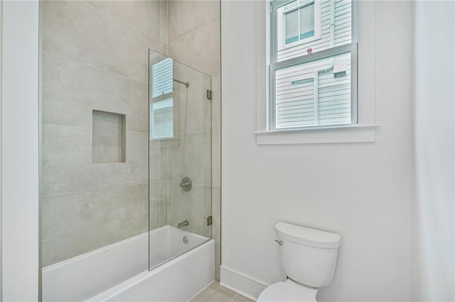 5310 Laurel St, New Orleans, LA 70115 - bathroom featuring shower / bath combination with glass door and tile patterned flooring