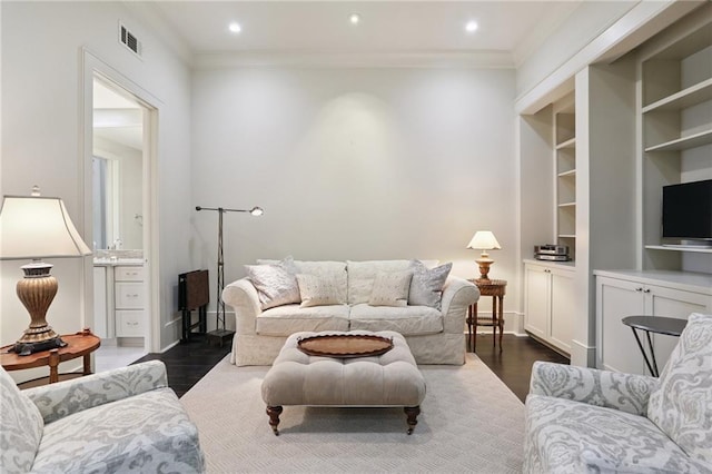 111 Audubon St Unit 202, New Orleans, LA 70118 - living room with crown molding, dark wood-style floors, recessed lighting, and built in shelves