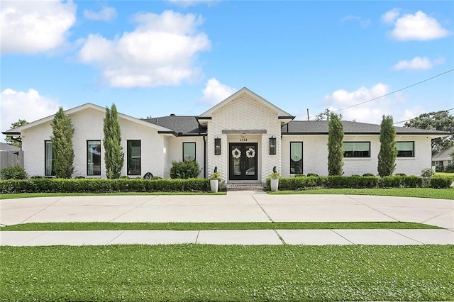 4548 Alphonse Dr, Metairie, LA 70006 - view of front of property featuring a front yard and brick siding