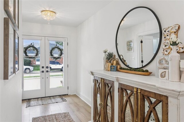 4548 Alphonse Dr, Metairie, LA 70006 - entrance foyer featuring french doors and light wood-style flooring