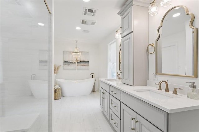 4548 Alphonse Dr, Metairie, LA 70006 - bathroom with double vanity, a freestanding tub, recessed lighting, and a shower with shower door
