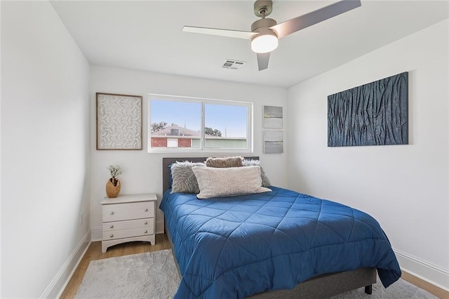 4548 Alphonse Dr, Metairie, LA 70006 - bedroom with wood finished floors and a ceiling fan