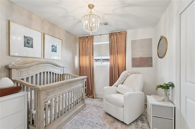 4548 Alphonse Dr, Metairie, LA 70006 - bedroom with a chandelier and a crib
