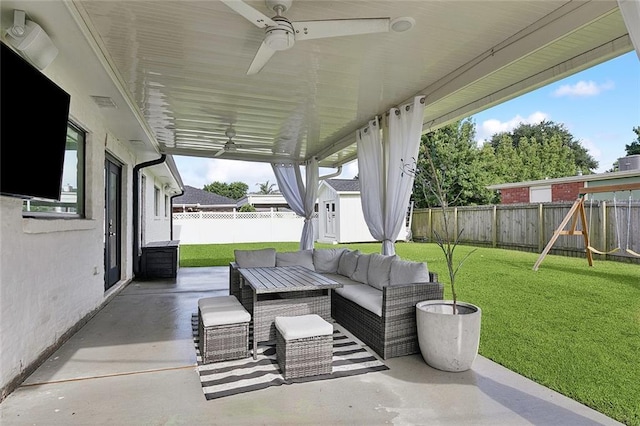 4548 Alphonse Dr, Metairie, LA 70006 - fenced backyard with a ceiling fan, a patio, a playground, and an outdoor hangout area